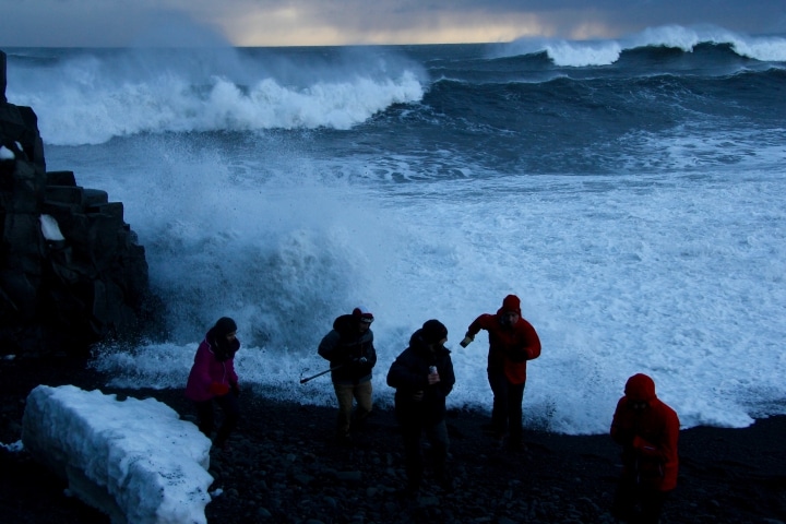 Tourists Caught by Waves in Reynisfjara