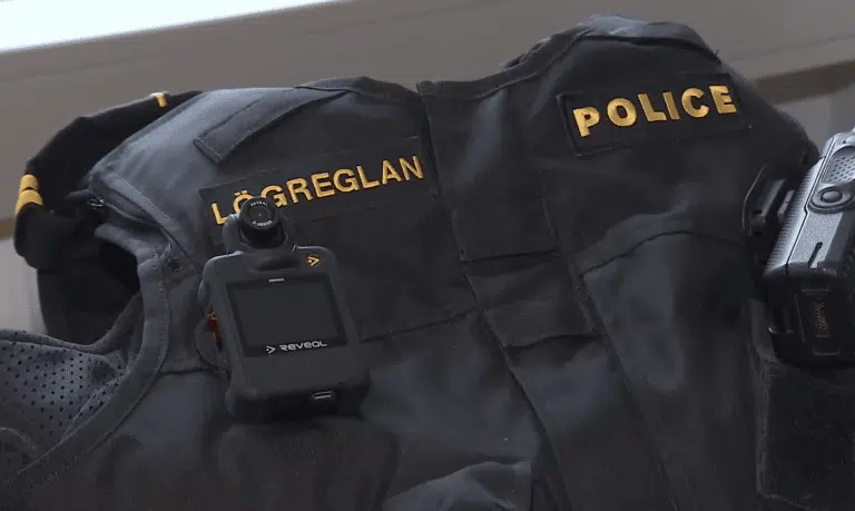 A body camera attached to a police vest.