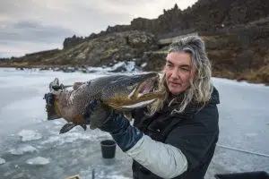 Biologist Jóhannes Sturlaugsson in Þingvallavatn with brown trout