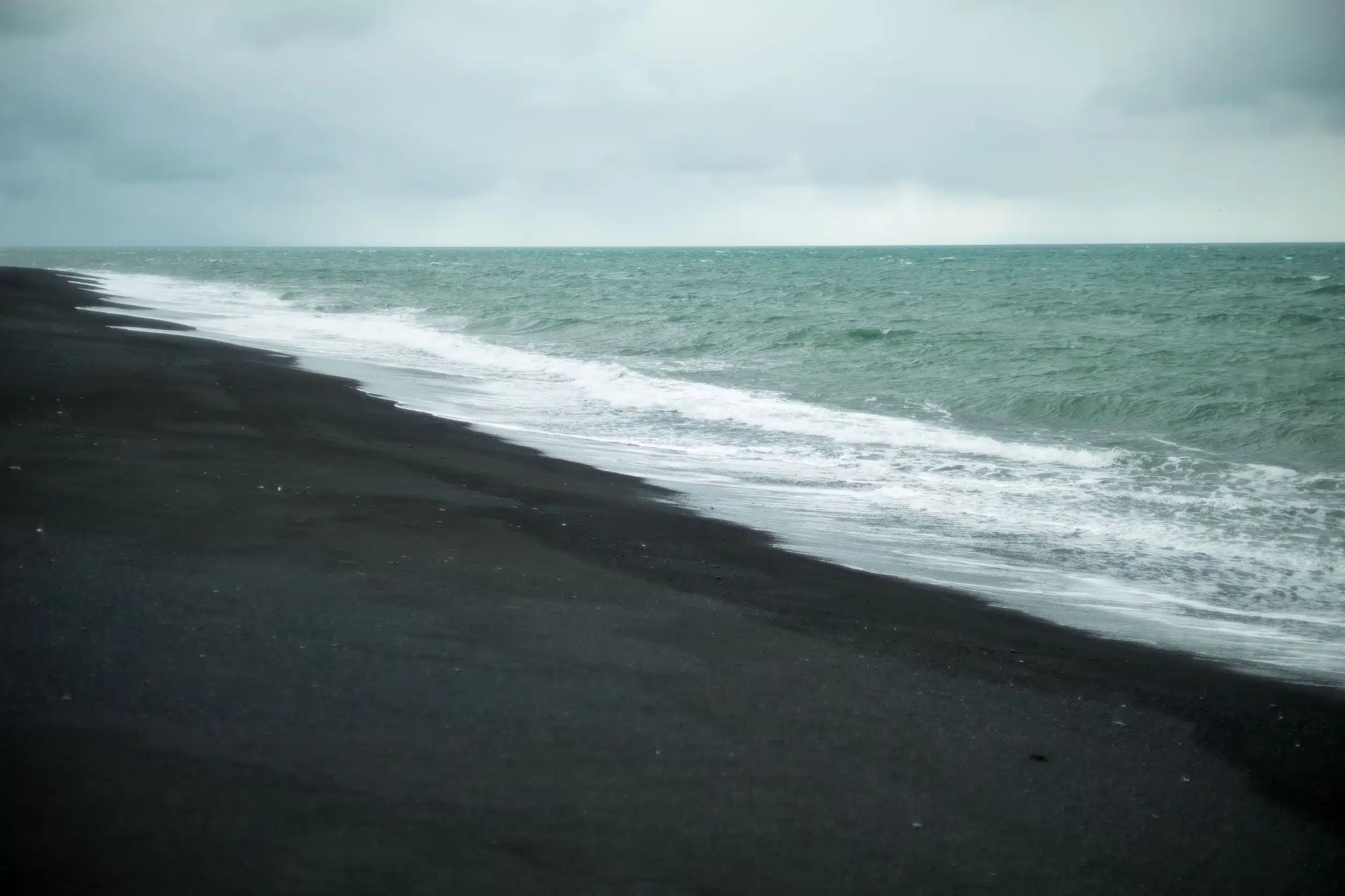 Why is the sand black in Iceland?