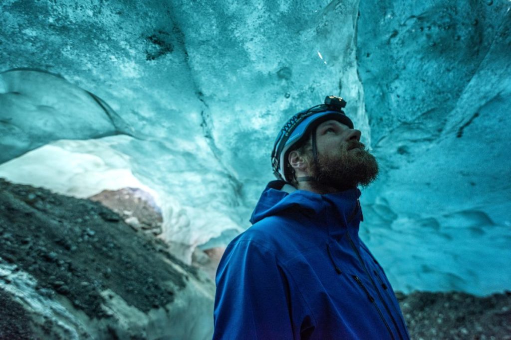 A man inside an Icelandic ice cave 