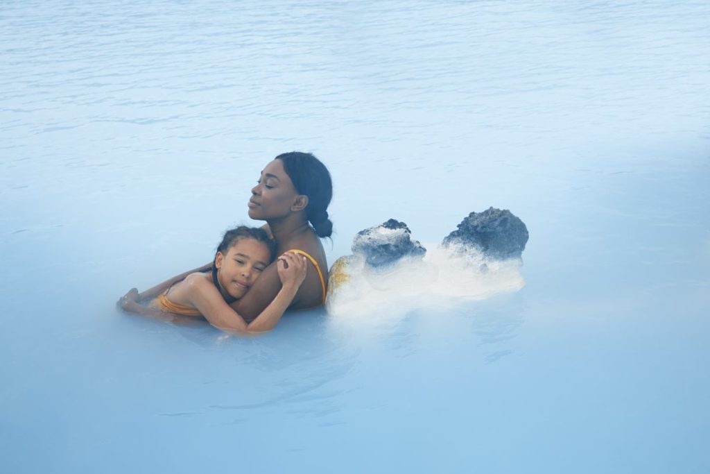 A woman and her child relaxing at the Blue Lagoon