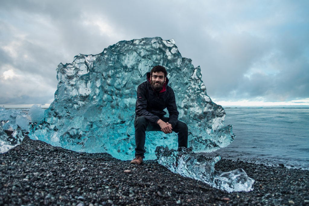 Posing at an ice berg during winter in Iceland